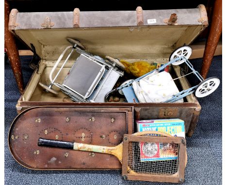 A vintage trunk containing a large quantity of vintage toys.