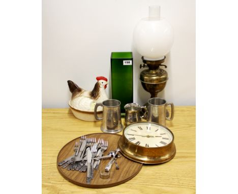 An oil lamp and a group of mixed items.