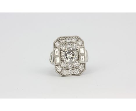 A large 950 platinum ring set with a 1.5ct brilliant cut diamond surrounded by brilliant cut diamonds, approx. 3.5ct overall,