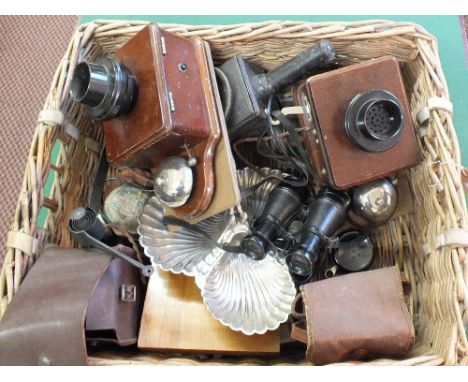 A basket containing vintage telephones, shop bell, Hardy rod bag etc