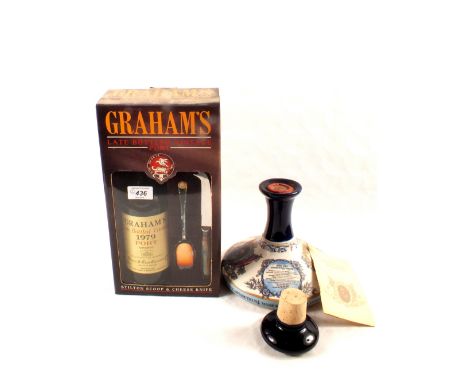 A boxed Grahams 1979 late bottled vintage port and accessories plus British Navy Pussers rum in Wade commemorative Nelson bot