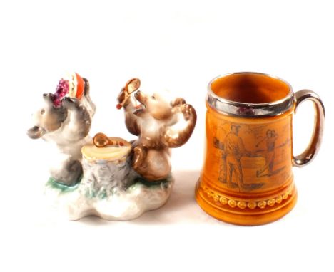 A continental porcelain bear inkwell plus a golfing mug