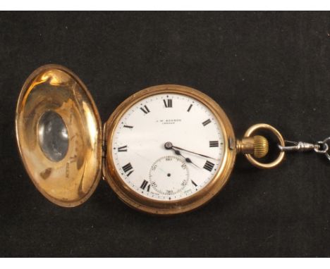 A gents 9ct gold half Hunter pocket watch (initials and light dents to rear, missing a hand)
