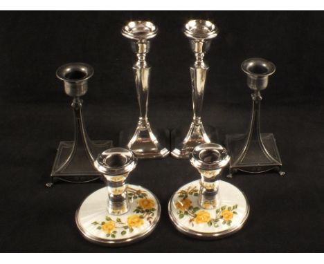 A pair of pewter candlesticks, a pair of silver candlesticks (as found), Birmingham 1926 plus a pair of white metal enamel ca