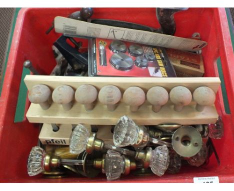 A box of woodworking tools and doorknobs etc