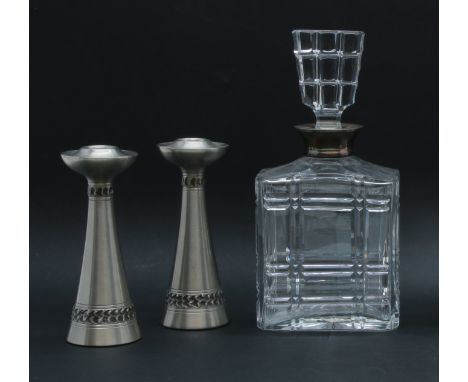 A pair of Norwegian pewter Henry Hertz candlesticks, 16cm high and a silver collared decanter, 25cm high