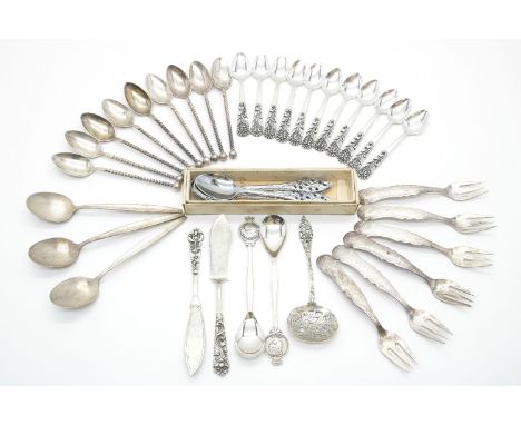 A collection of Scandinavian silver flatware, to include a set of ten coffee spoons and two butter knives with cast foliate d