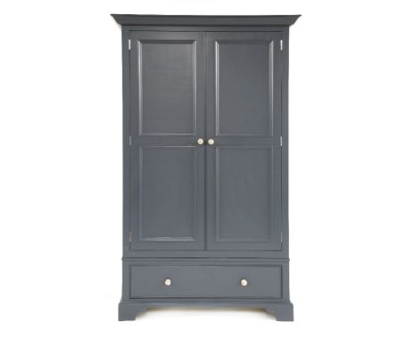 A 'Neptune' 'Chichester' blue painted wardrobe, the twin panelled doors opening to reveal hanging space within, over single d
