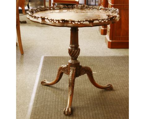 An 18th century style mahogany tripod table, with a carved and pierced gallery on a fluted column, diameter 77cm, height 76cm