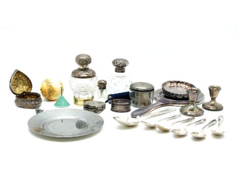 A collection of silver items to include two silver topped perfume jars and a heart shaped trinket box