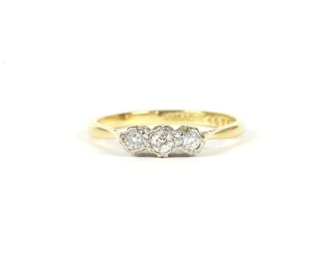 A gold three stone illusion set diamond ring, marked 18ct and PLAT, size R½, 3.05g