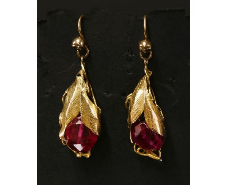 A pair of cased Victorian gold, synthetic ruby, drop earrings, with an oval, mixed cut, fully drilled ruby.  A cluster of tex