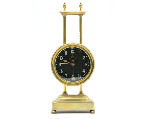 A brass 'Gravity' mantel clock, 26cm high