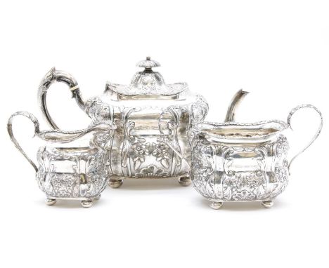 A late Victorian three piece silver tea service, with foliate decoration, by George Nathan &amp; Ridley Haynes, Chester 1898,