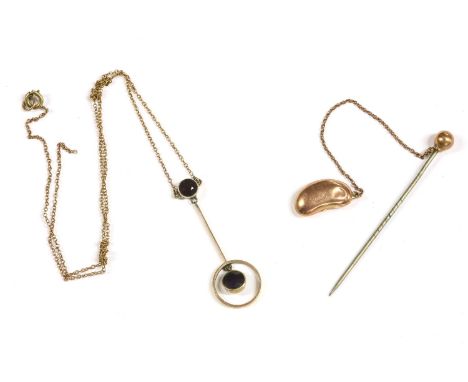 A gold hollow stick pin, with a trace chain bean (tested as approximately 9ct), 1.34g, a gold amethyst drop pendant, suspende