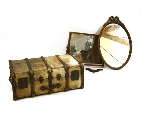 A vellum travelling trunk, 90cm x 55cm, together with an oak bracket clock, and two mirrors
