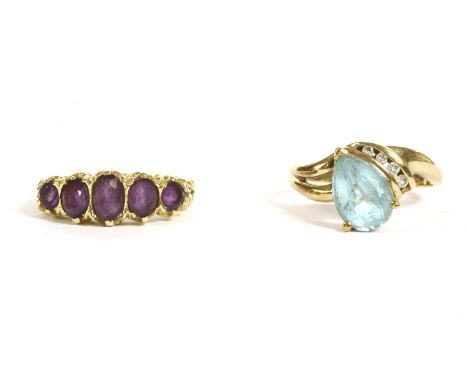 An 18ct gold five stone graduated oval cut amethyst ring, 4.83g, and a gold pear shaped topaz and diamond cluster to a plain 