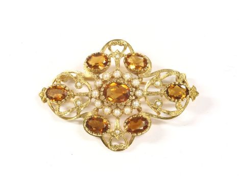 A gold citrine and split pearl open framed brooch, a central oval mixed cut citrine, set to a cluster of split pearls with si