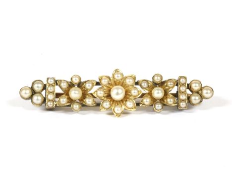 A ladies Swiss gold Rotary mechanical strap watch, stamped 18k, with Arabic numerals, and a cultured seed pearl floral cluste