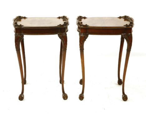 A pair of mahogany lamp tables, the shaped tops with pierced gallery, raised on slender cabriole supports, 51cm wide, 51cm de