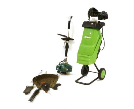 A 'Gardenline' petrol strimmer, with hedgecutter, chainsaw and strimmer attachmnts, and a 'Handy' electric shredder