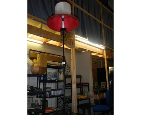 A wrought iron standard lamp. COLLECT ONLY.