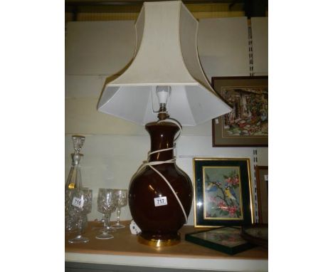 A brown ceramic table lamp.