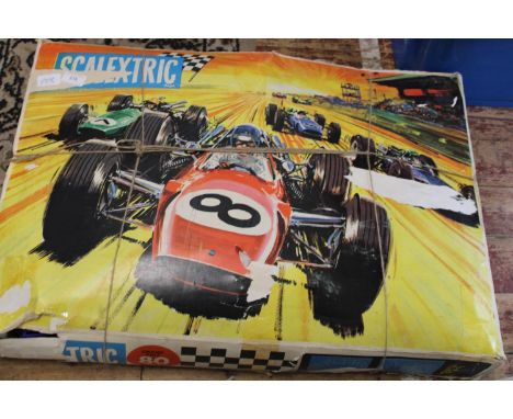 A boxed vintage Scalextric set missing power unit