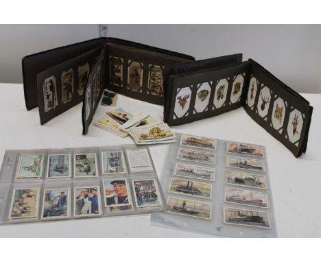 A selection of vintage cigarette cards and other 