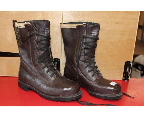 A pair of brown leather class 2 chainsaw boots size 9 