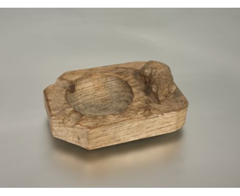 Workshop of Robert "Mouseman" Thompson of Kilburn, an English oak ashtray, with carved mouse signature. 10.5cm.