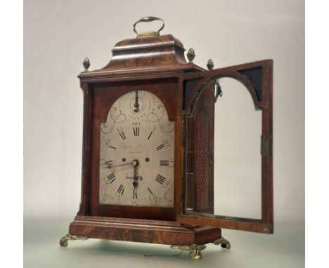 A handsome George III gilt-brass mounted mahogany bracket clock, the arched silvered dial with Roman and Arabic numerals, wit