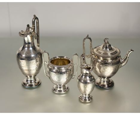 A striking late Victorian silver four piece tea and coffee service in the Greek Revival taste, Martin Hall &amp; Co., London 