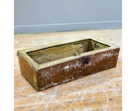 A honey-glazed stoneware planter with drilled drainage holes. Height 20cm, length 75cm, width 40cm.