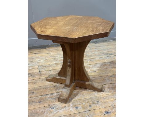 Workshop of Robert "Mouseman" Thompson of Kilburn, an oak lamp table of octagonal form on a cruciform base and sledge feet wi