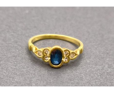 An 18ct gold, sapphire and diamond ring, ring size O