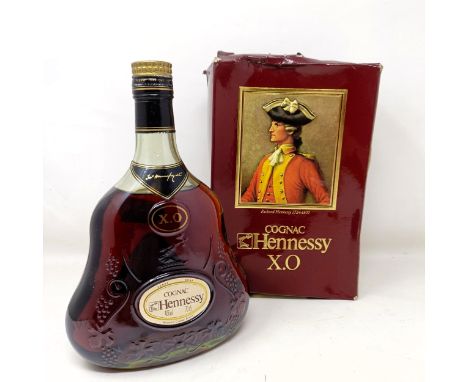 A bottle of Hennessy XO cognac, with its cardboard box