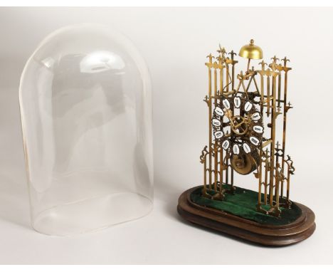 A VERY GOOD BRASS SKELETON CLOCK CATHEDRAL SHAPED, striking on a single bell with glass dome. 15ins high.