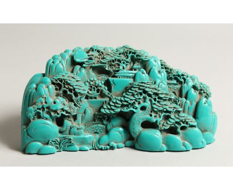 A CHINESE CARVED TURQUOISE BOULDER 9.5ins long.