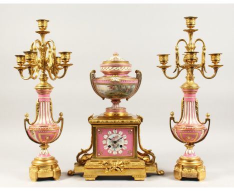 A VERY GOOD 19TH CENTURY FRENCH ORMOLU AND PORCELAIN THREE PIECE CLOCK GARNITURE, the clock with porcelain urn finials and co