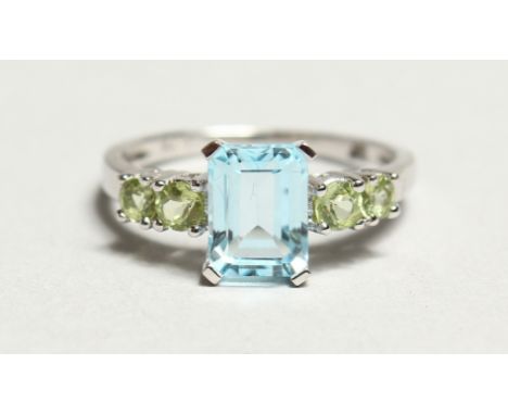 A SILVER AND AQUAMARINE FIVE STONE RING