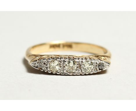 AN 18CT GOLD AND DIAMOND RING