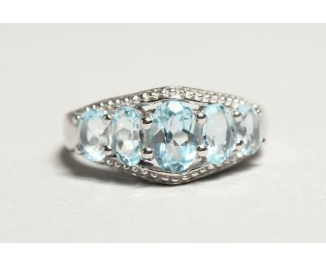 A SILVER AND AQUAMARINE FIVE STONE RING