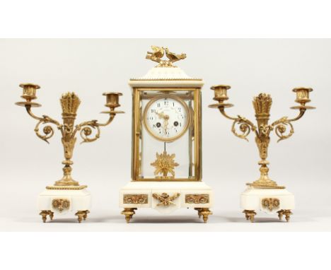 A GOOD FRENCH LOUIS XVITH DESIGN WHITE MARBLE AND ORMOLU THREE PIECE CLOCK GARNITURE, the clock with circular dial. Stamped L