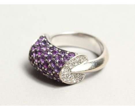 AN 18CT WHITE GOLD AMETHYST AND DIAMOND RING.