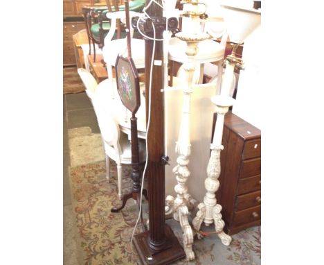 A MAHOGANY PILLAR STANDARD LAMP. H180CM