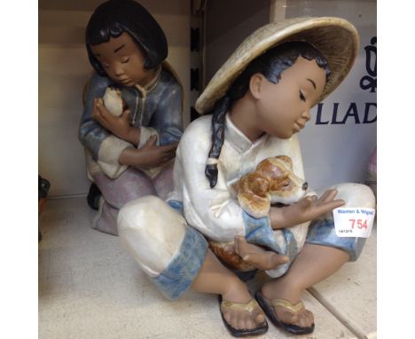 TWO LLADRO FIGURES OF GIRLS WITH ANIMALS. 20CM