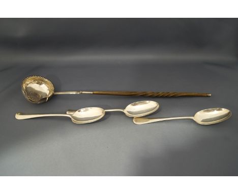 A Georgian coin set punch ladle, with bone twist handle; and three modern silver Hanoverian pattern dessert spoons; 132g (4.2