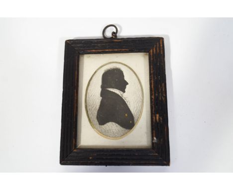 An early 19th century portrait silhouette of a Gentleman, watercolour and gilt highlights, framed, 9cm x 6.5cm