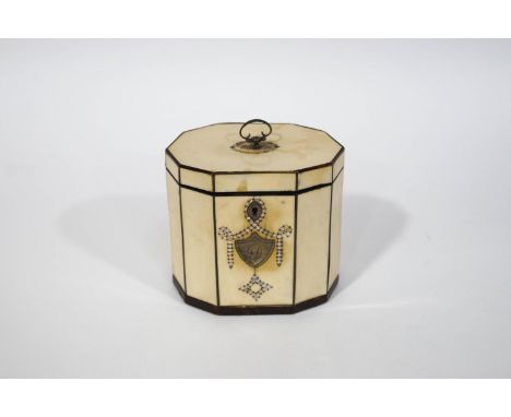 A George III ivory and tortoiseshell ten sided tea caddy, the lid with mother of pearl inlay, with interior lid, 12cm high in